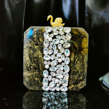 Beautiful Marble Clutch Embellished With Emerald Stones